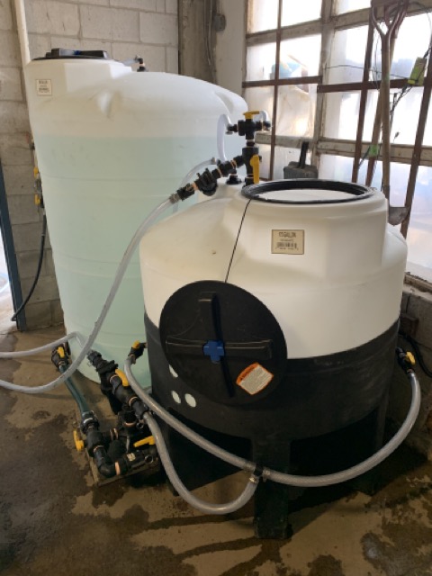 Two turf sprayer tanks